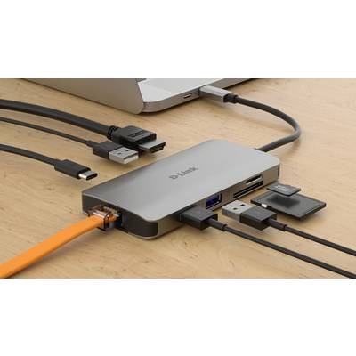 Laptop verbunden mit einem USB-C-Hub. Der Hub verfügt über mehrere Anschlüsse: HDMI, USB, Ethernet, SD-Karten und MicroSD-Kartenleser.