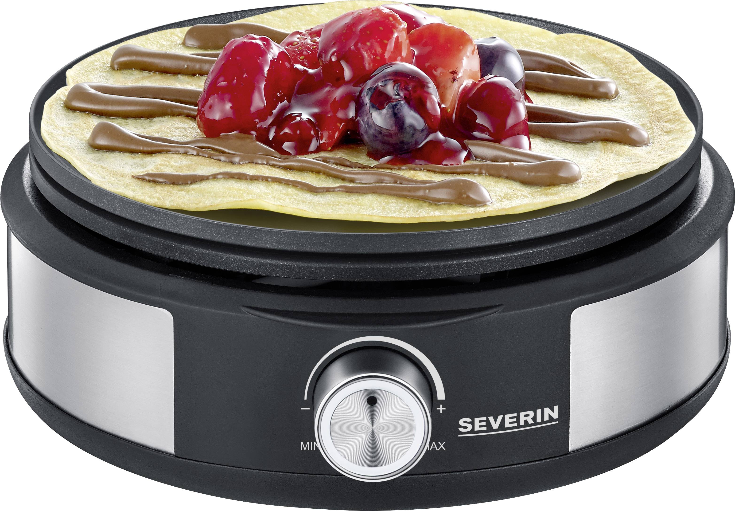 Crêpes-Maker mit fertigem Crêpe, dekoriert mit Schokosoße und Früchten. Gerät ist schwarz-silbern mit Drehknopf für Temperatureinstellung.