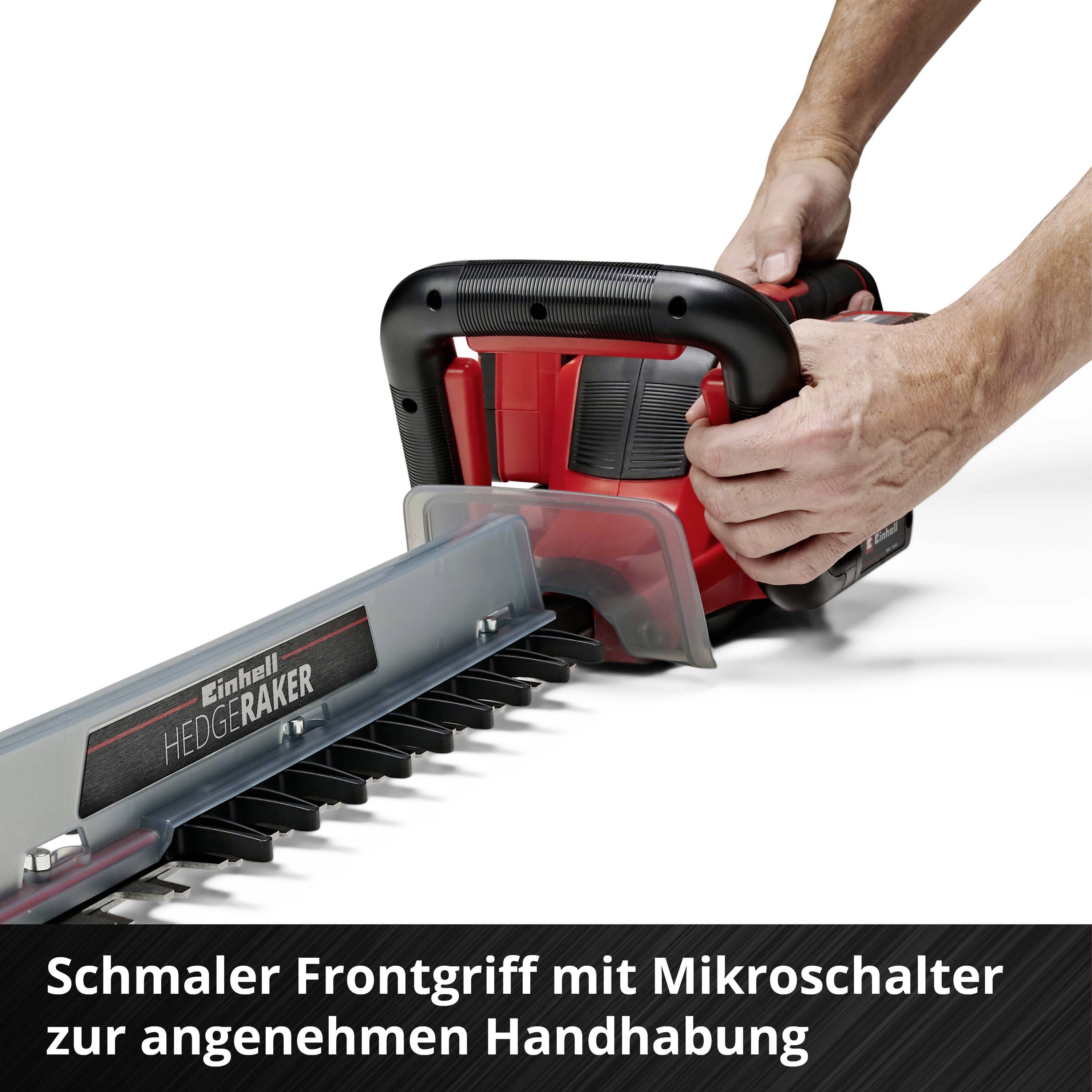 Einhell Heckenschere mit schmalem Frontgriff und Mikroschalter. Hände halten die Hecke, betonen angenehme Handhabung.