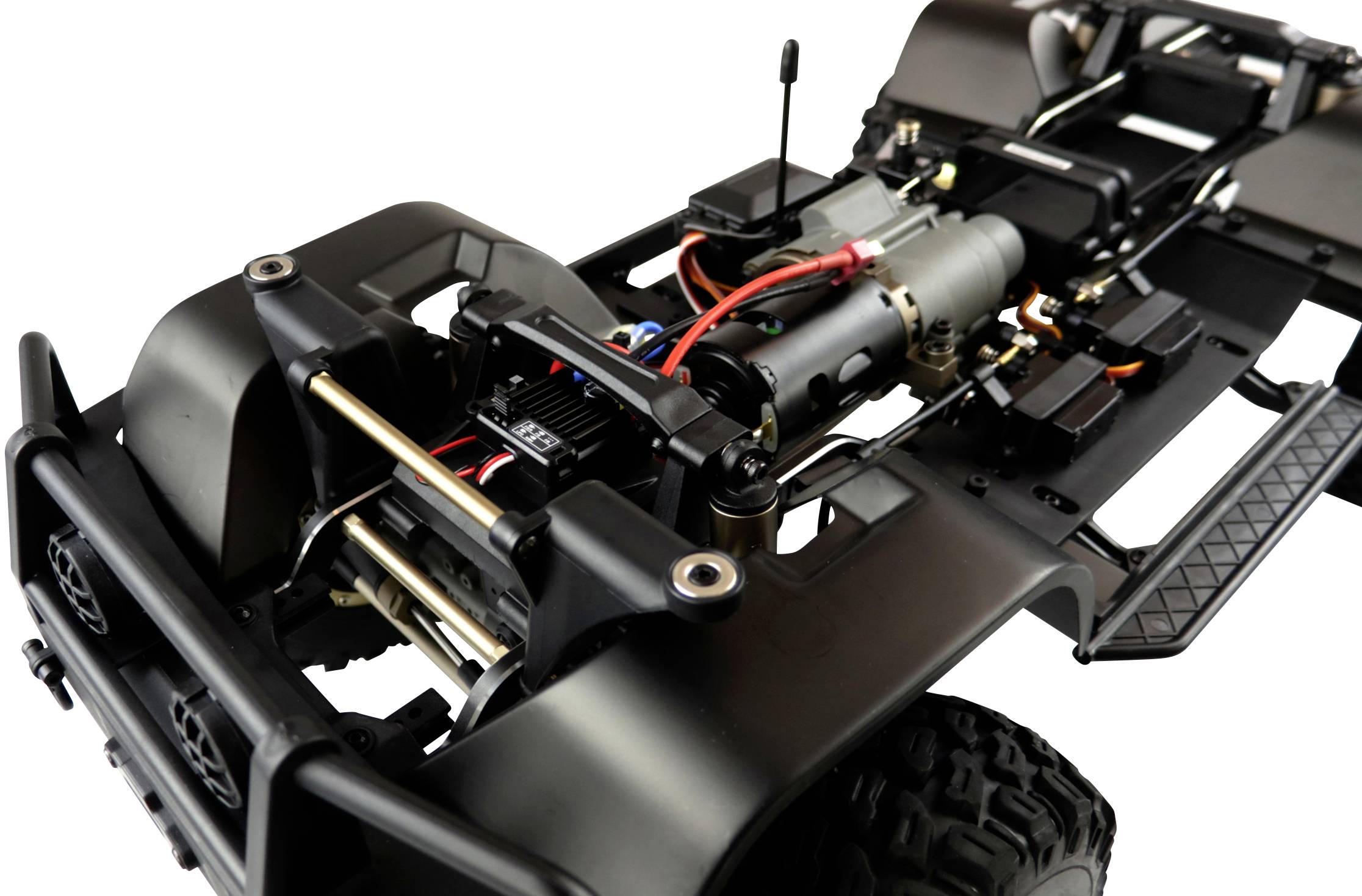 Ein ferngesteuertes Auto-Chassis mit sichtbaren Motoren und Elektronik, bereit für den Zusammenbau und Einsatz im Modellbau.