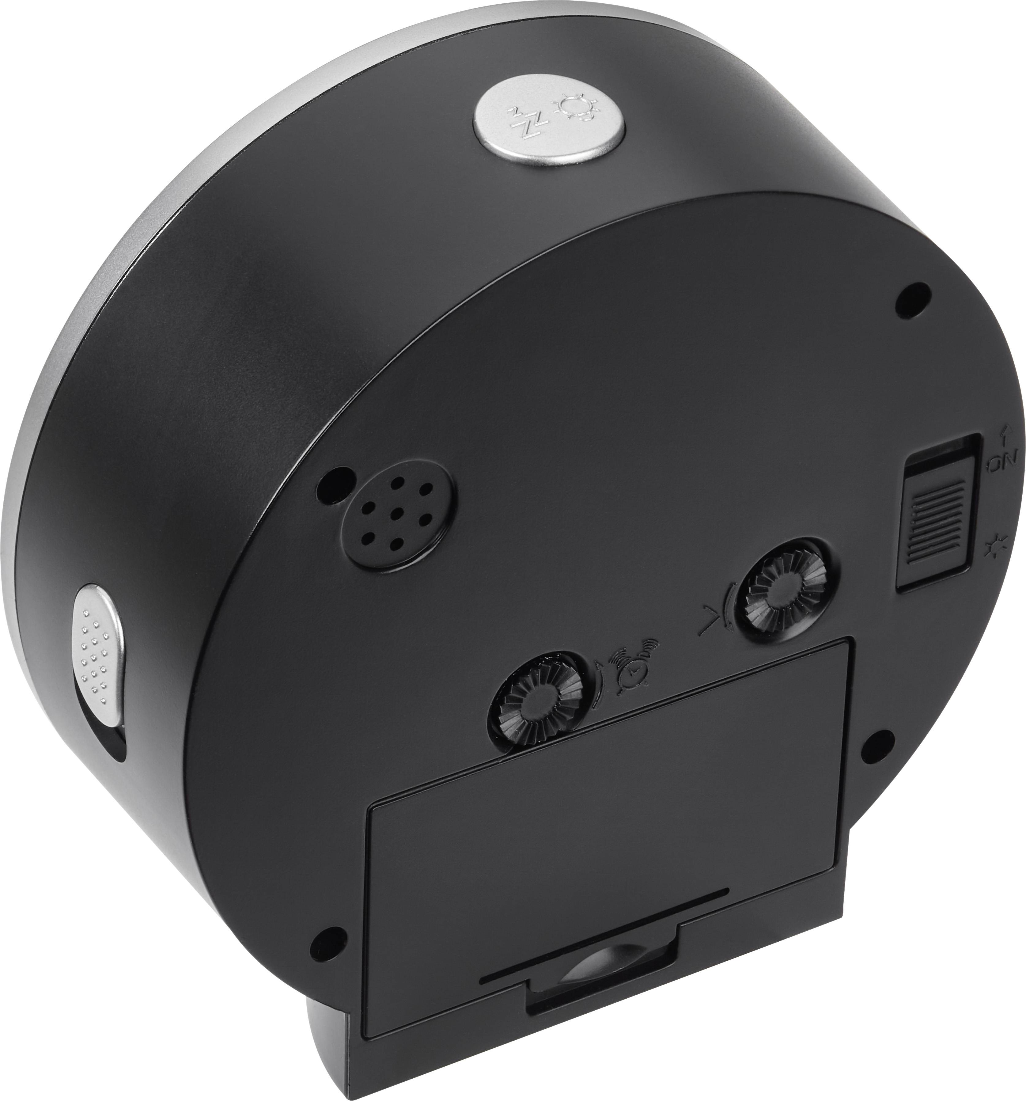 Schwarze, runde Tischuhr mit Einstellknöpfen und Batteriefach auf der Rückseite, silbernem Detail oben.