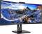 Ein breiter, gebogener Monitor mit einem schneebedeckten Bergpanorama auf dem Bildschirm. Ideal für immersives Arbeiten oder Gaming.