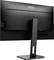 Ein schwarzer AOC-Monitor von hinten mit rechteckigem Standfuß und schmalem Rahmen, auf einem Schreibtisch platziert.