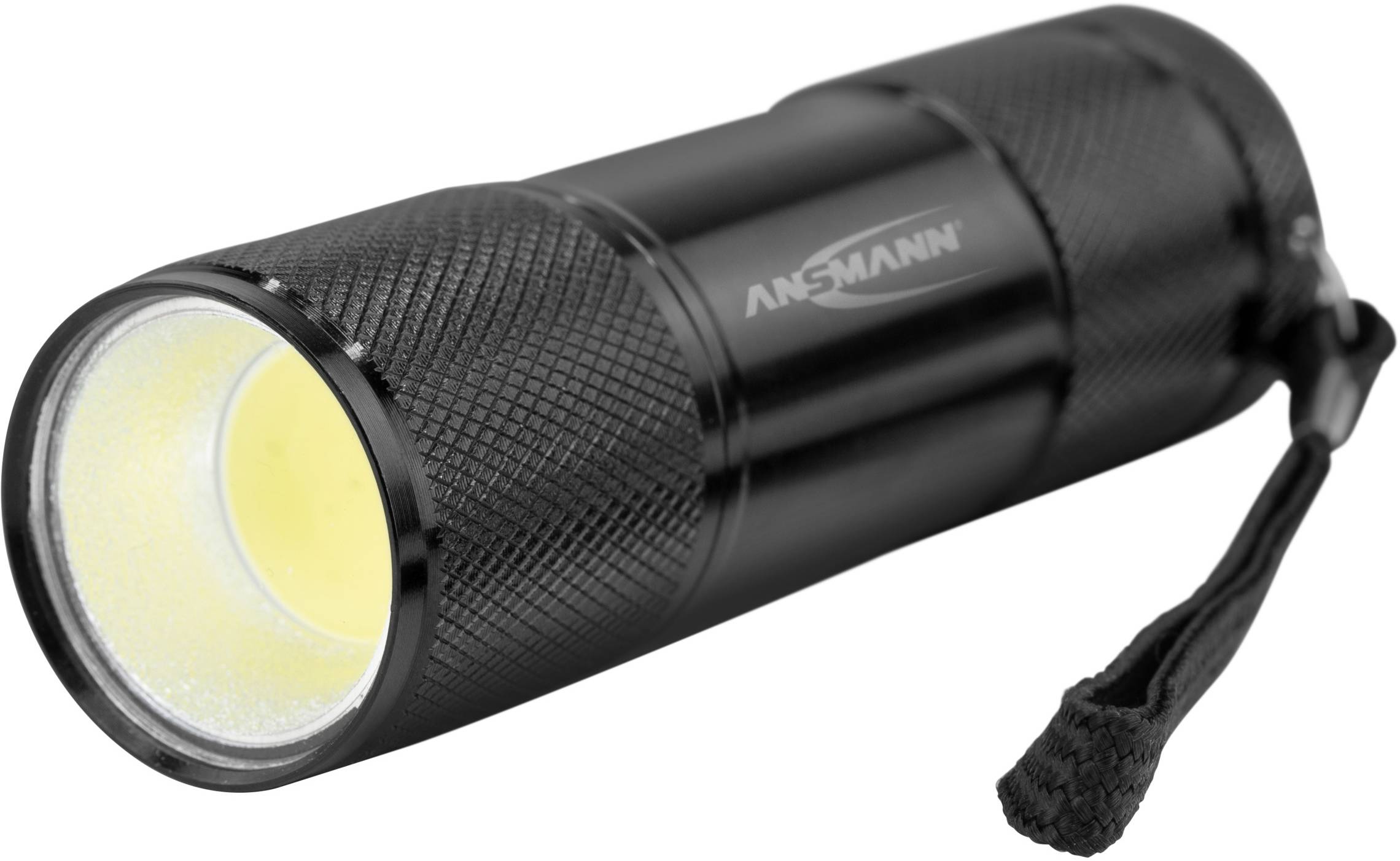 Schwarze Handtaschenlampe mit griffiger Struktur, gelbem Scheinwerferlicht und Handschlaufe an der Rückseite.