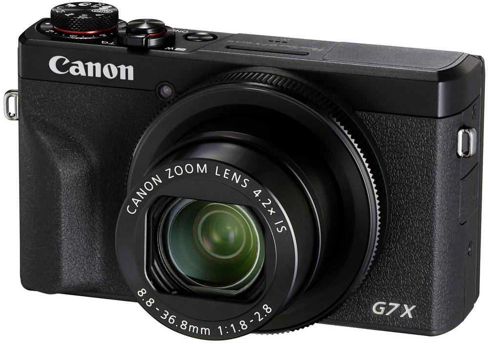 Kompaktkamera mit großem Objektiv und der Aufschrift 'Canon G7X' auf der Vorderseite. Ideal für hochwertige Fotografie unterwegs.