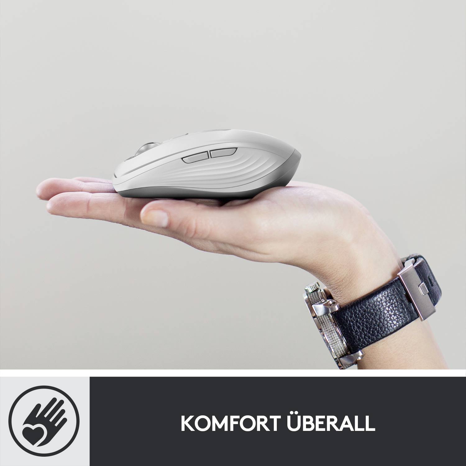 Eine Hand hält eine Computermaus; darunter der Text 'Komfort überall'. Außerhalb des Bildes befindlich ist das Logo einer Hand mit einem Herz.