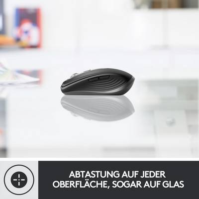 'Kabellose Computermaus auf einem Glastisch; Text darunter: Abtastung auf jeder Oberfläche, sogar auf Glas.'