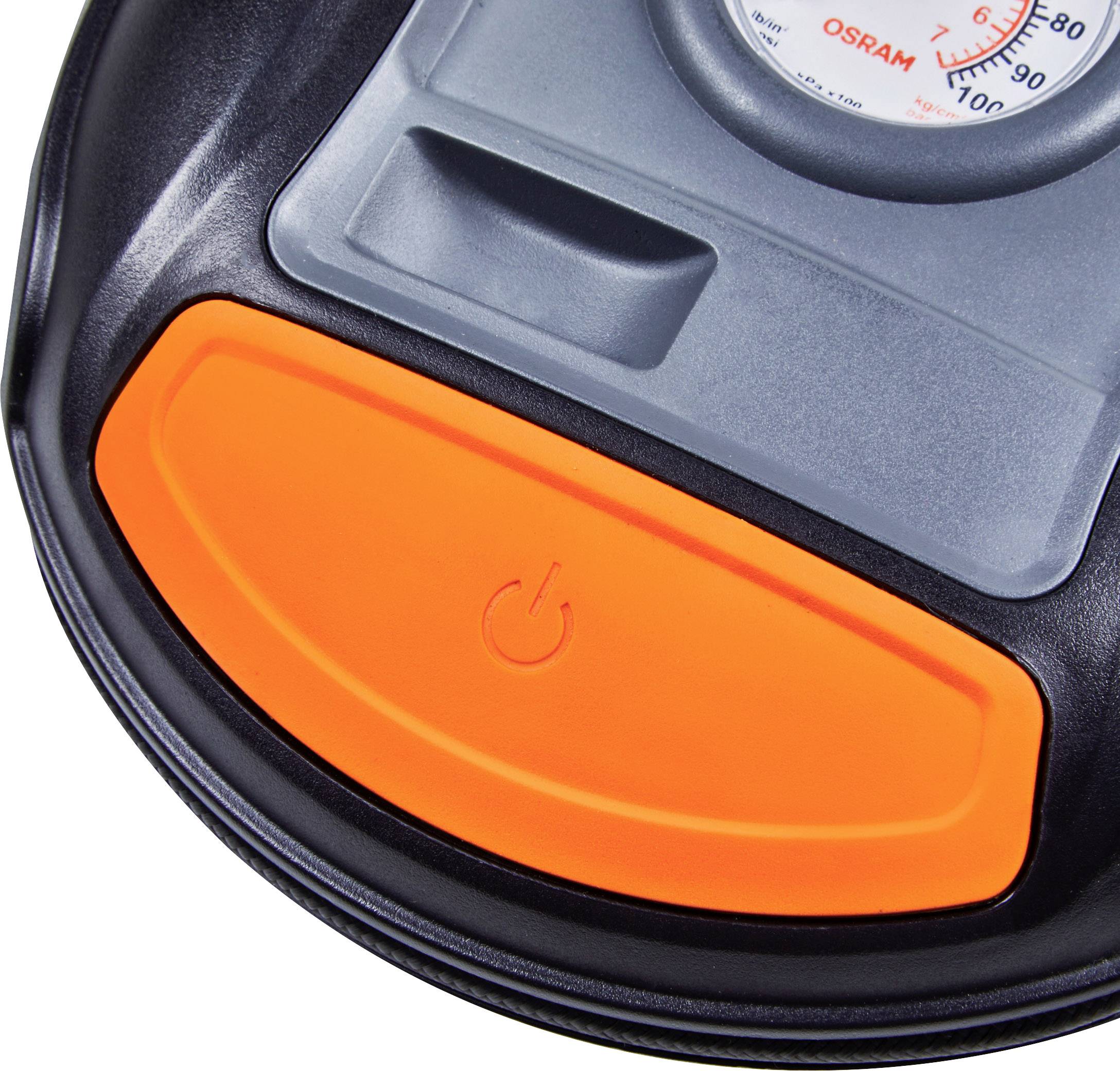 Nahaufnahme eines elektrischen Geräts mit einem orangefarbenen Ein-/Ausschalter und einem Manometer im Hintergrund.