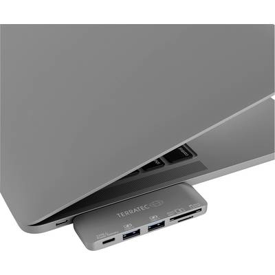 Grau-silberner Laptop mit teilweise geschlossener Klappe, angestecktem USB-Hub darunter. Auf dem Hub: Markenname und verschiedene Anschlussports.