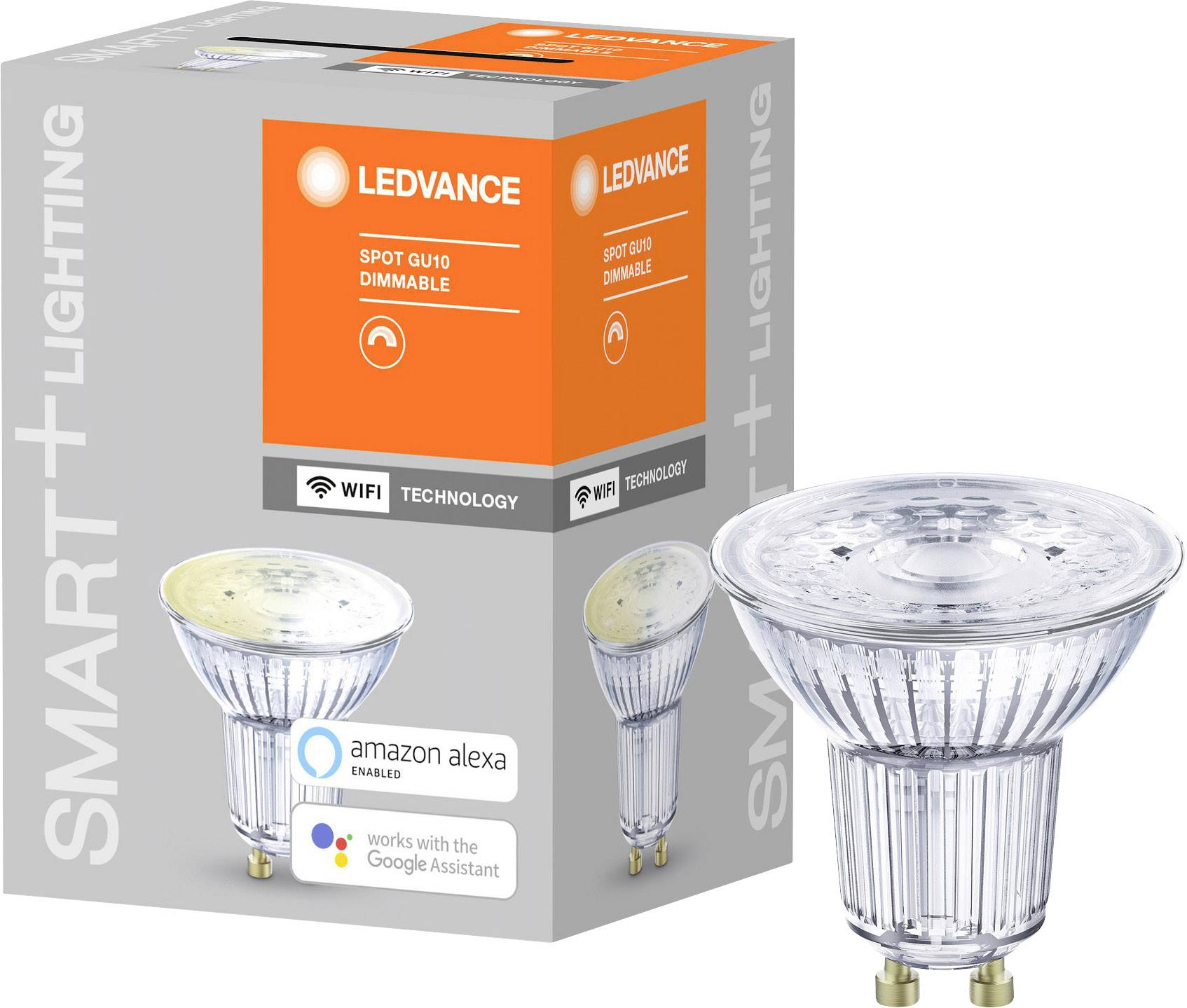 Eine LED-Lampe neben ihrer Verpackung. Auf der Box steht 'LEDVANCE Spot GU10 dimmable', mit Symbolen für WLAN und Sprachassistenten-Unterstützung.