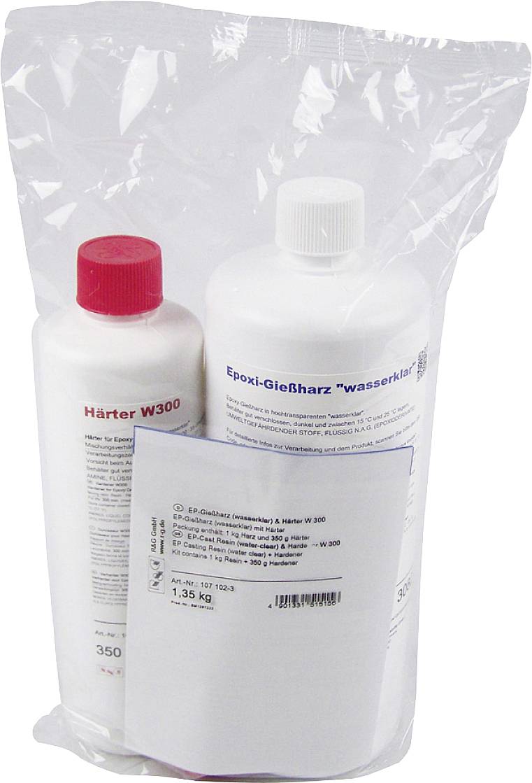 Zwei Flaschen in einer Plastiktüte: links eine rote Kappe mit der Aufschrift 'Härter W300', rechts eine weiße Kappe mit 'Epoxi-Gießharz wasserklar'.