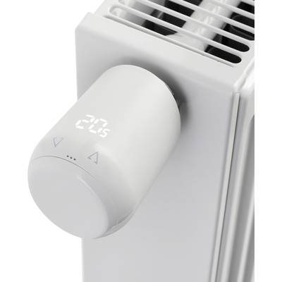 Ein Thermostat an einem weißen Heizkörper zeigt '20°C'.