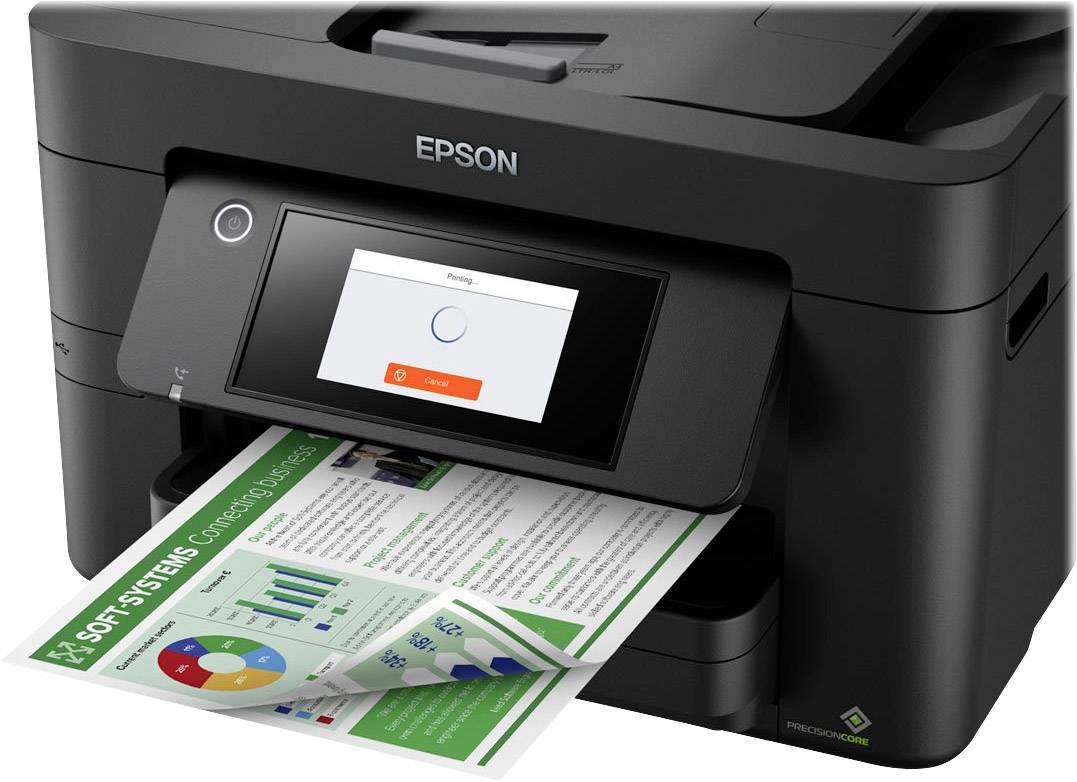 Ein schwarzer Drucker mit einer gedruckten Seite, die Grafiken und Text zeigt, steht auf einem Tisch. Das Display zeigt einen Druckfortschritt.