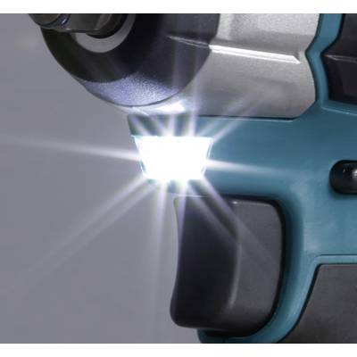 Ein Akku-Bohrschrauber mit leuchtender LED-Lampe vor einem verschwommenen Hintergrund.