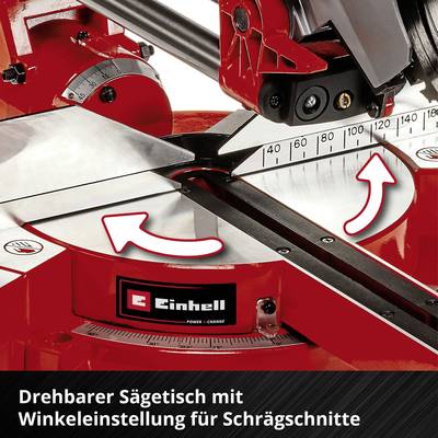 Eine rote Säge mit drehbarem Sägetisch und Winkeleinstellung für Schräge. Pfeile zeigen Drehrichtung.