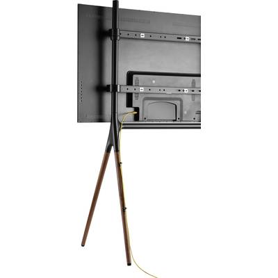 Rückansicht eines Fernsehers auf einem Stativ mit drei Beinen aus Holz; ein gelbes Kabel verläuft entlang eines Stativbeins.