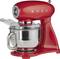 Roter Küchenmixer mit aufgesetzter Edelstahlschüssel, Markenname 'Smeg' auf dem Gehäuse, modernes Design.