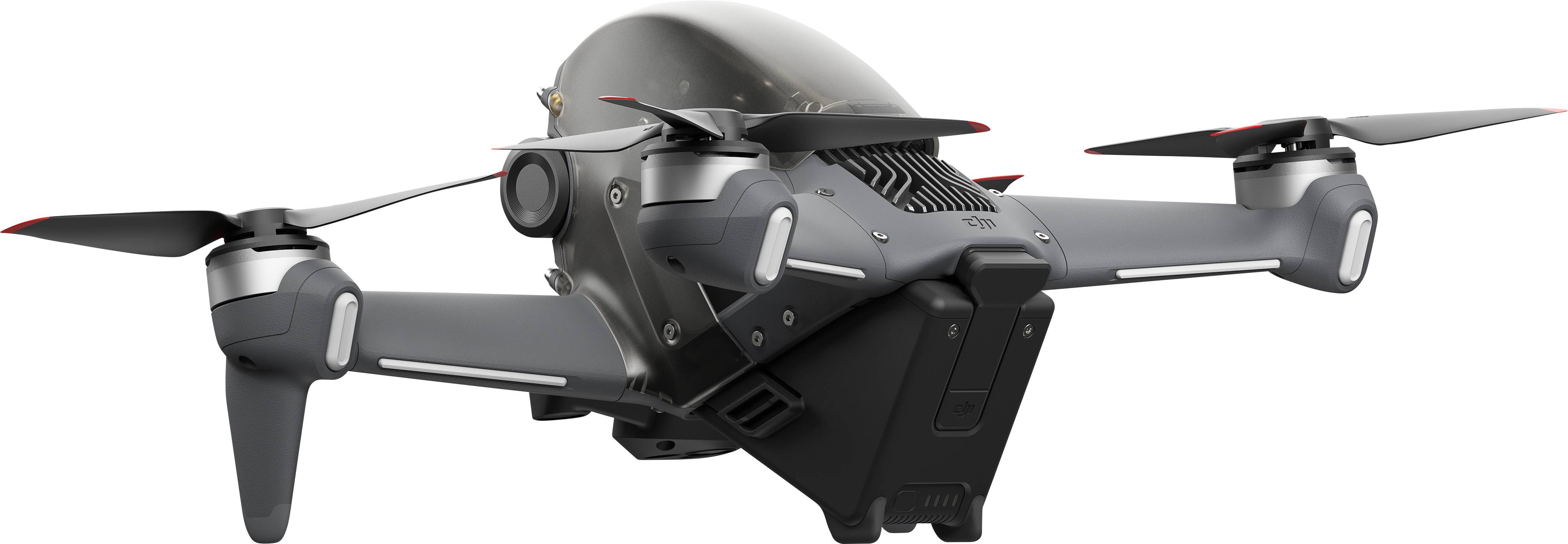 Eine moderne Drohne mit vier Rotoren, schwarzem Gehäuse und kameraähnlichem Objektiv an der Vorderseite, schwebt in der Luft.