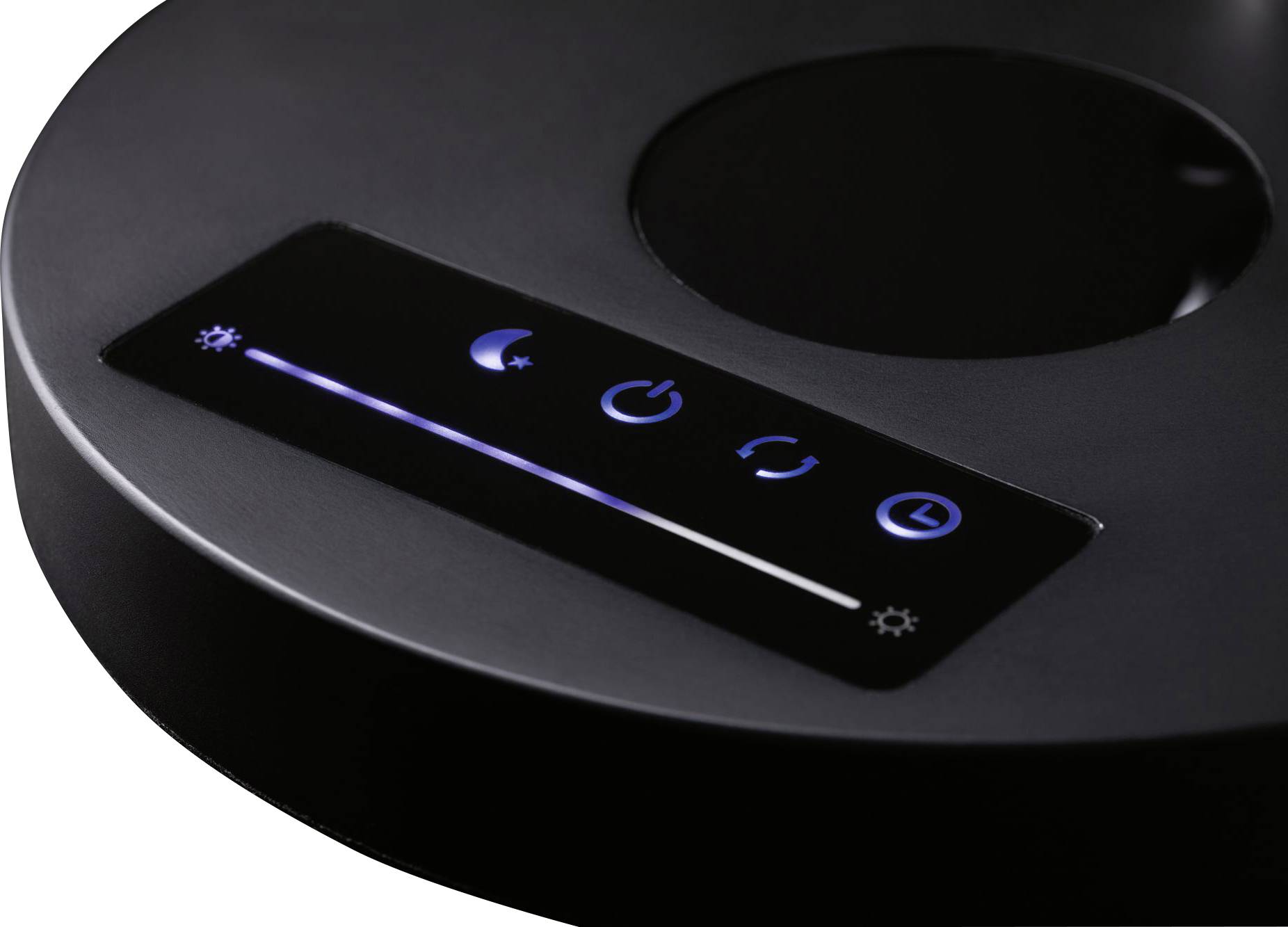 Ein schwarzes Gerät mit Touch-Bedienfeld zeigt Symbole für Helligkeit, Nachtmodus, Ein/Aus, Refresh und Timer an.