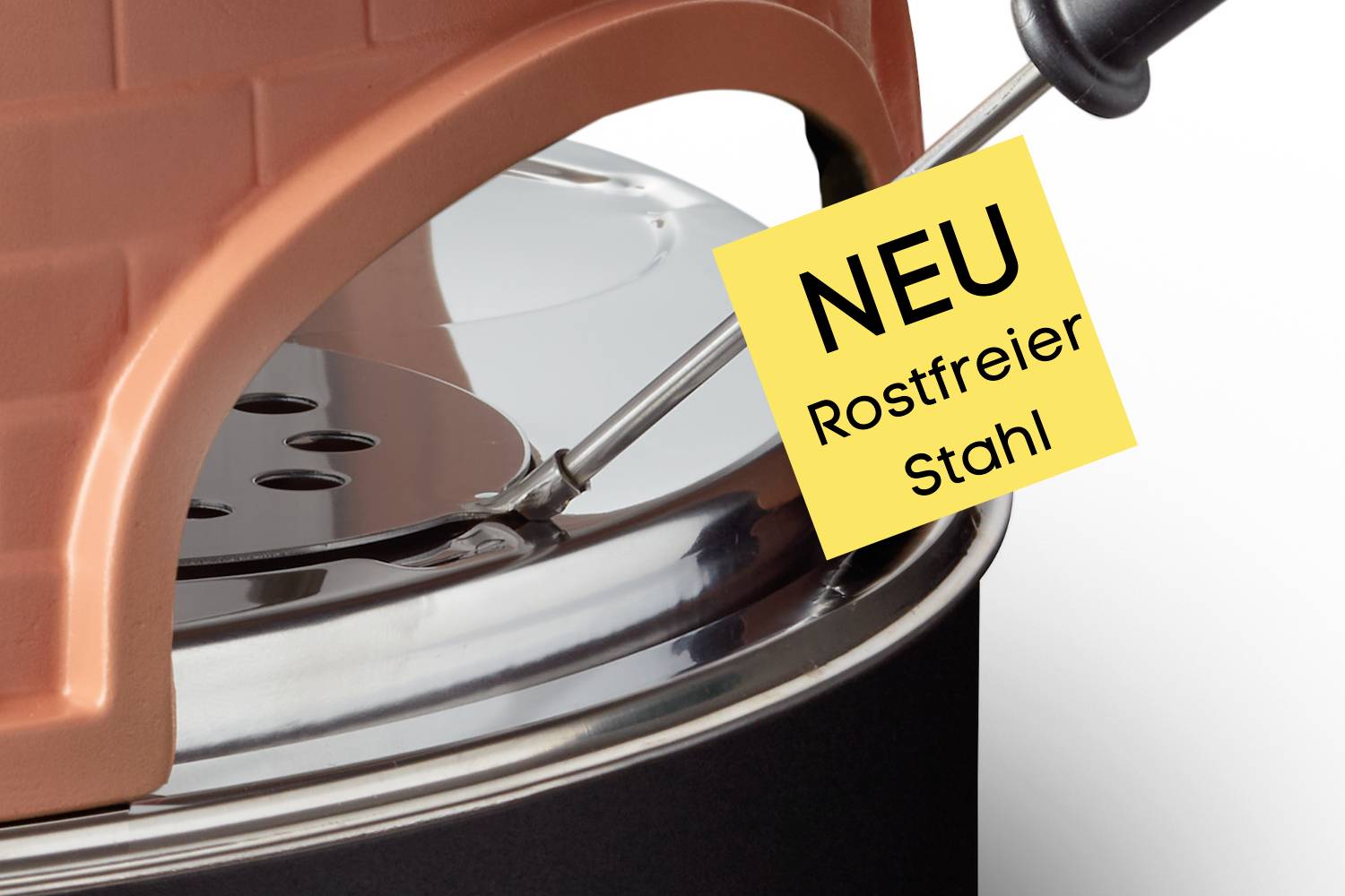 Grilldeckel mit Temperaturfühler aus Edelstahl. Ein gelber Zettel mit der Aufschrift 'NEU Rostfreier Stahl' ist angebracht.