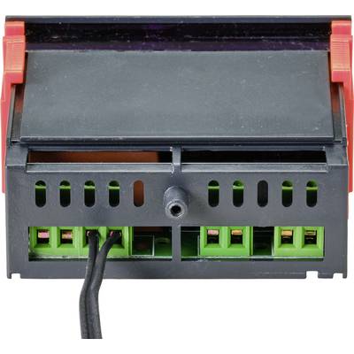 Ein schwarzes elektrisches Gerät mit grünem Innenleben und roten Seiten. Zwei schwarze Kabel sind unten links angeschlossen.