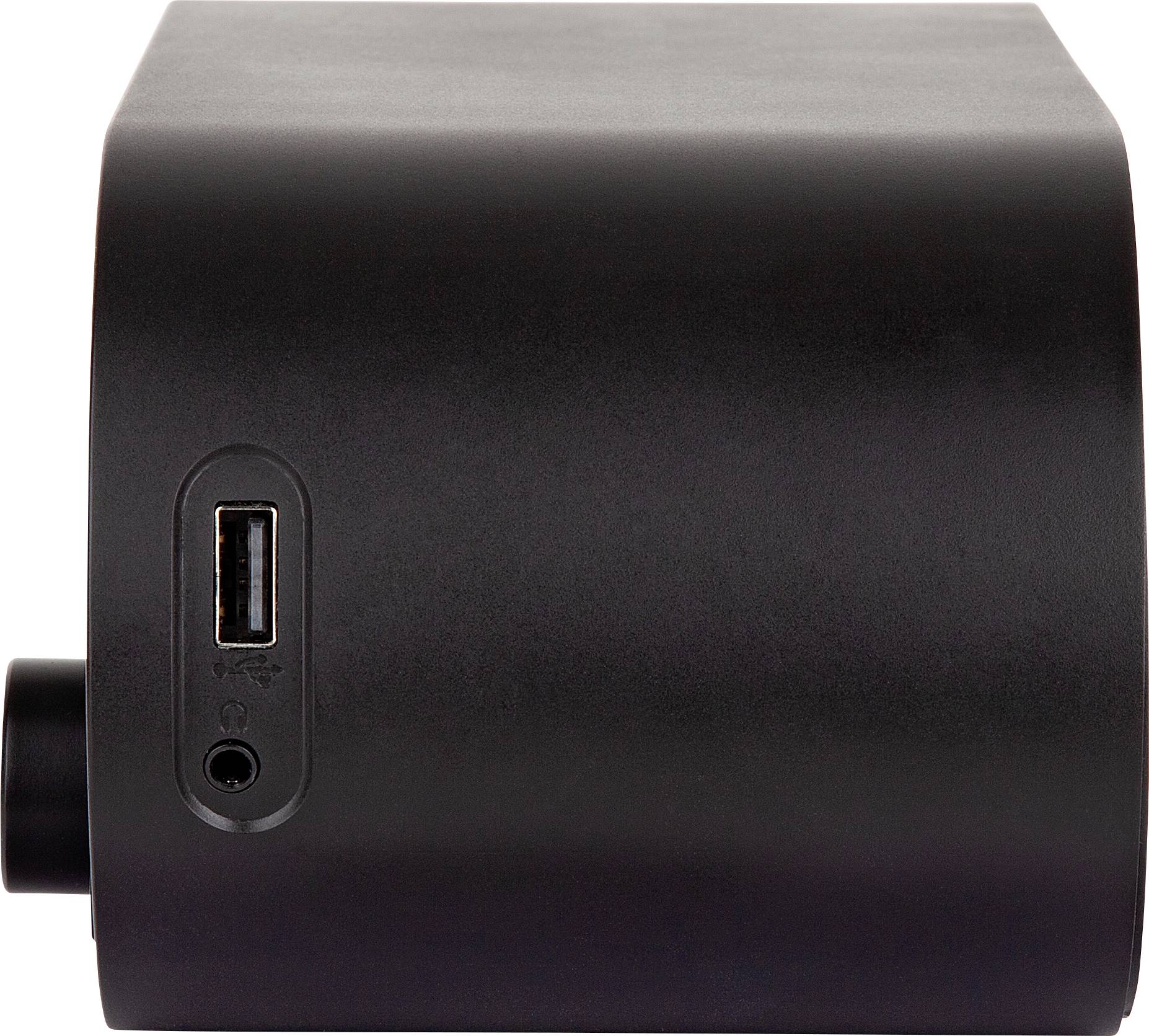 Ein schwarzer, rechteckiger Lautsprecher mit USB-Anschluss an der Seite, präsentiert auf einer hellen Oberfläche.