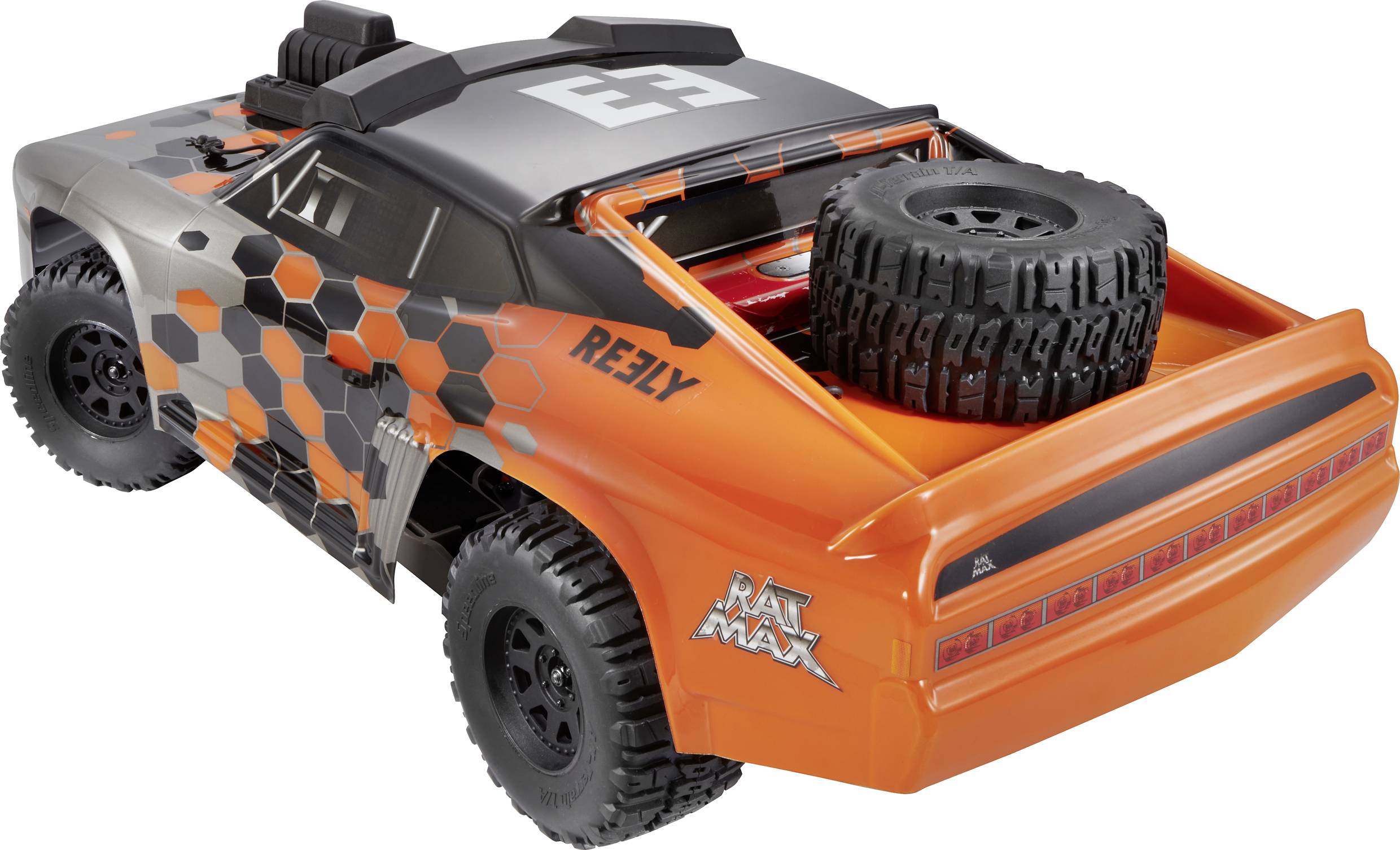 Ein orange-schwarzes ferngesteuertes Spielzeugauto im Offroad-Stil mit Reserverad auf der Ladefläche und dem Schriftzug 'Reely'.