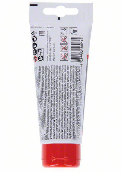 Eine rote Tube mit Sicherheitssymbolen auf der Rückseite, Hinweisen zur Verwendung und Pflegehinweisen.