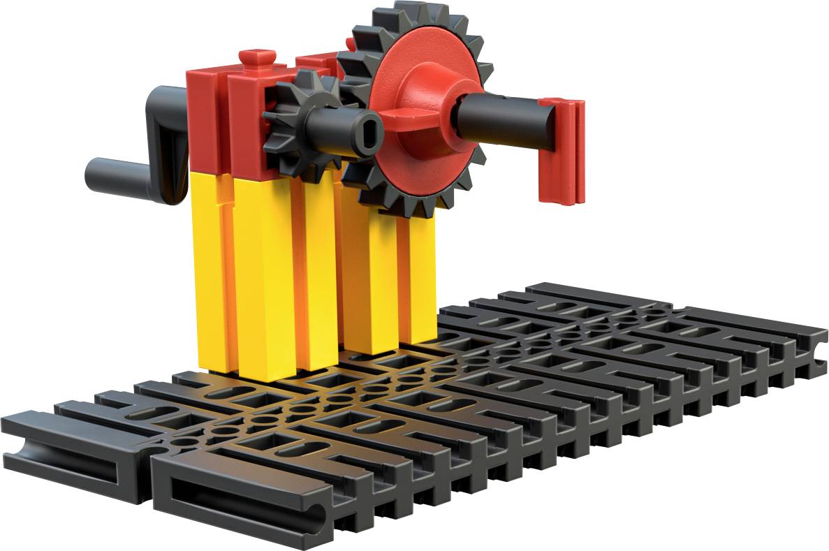 Modell eines Zahnradmechanismus aus Kunststoff in Schwarz, Rot und Gelb auf einer schwarzen Plattform.