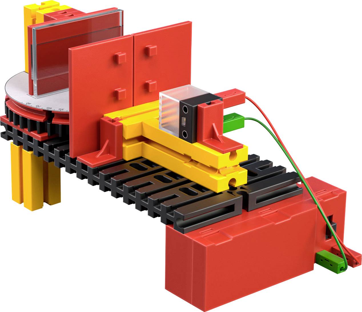 Bunte Spielzeugmaschine aus Kunststoff mit rot, gelb und schwarzen Teilen, inkl. Maßskala und elektrischen Verbindungen.