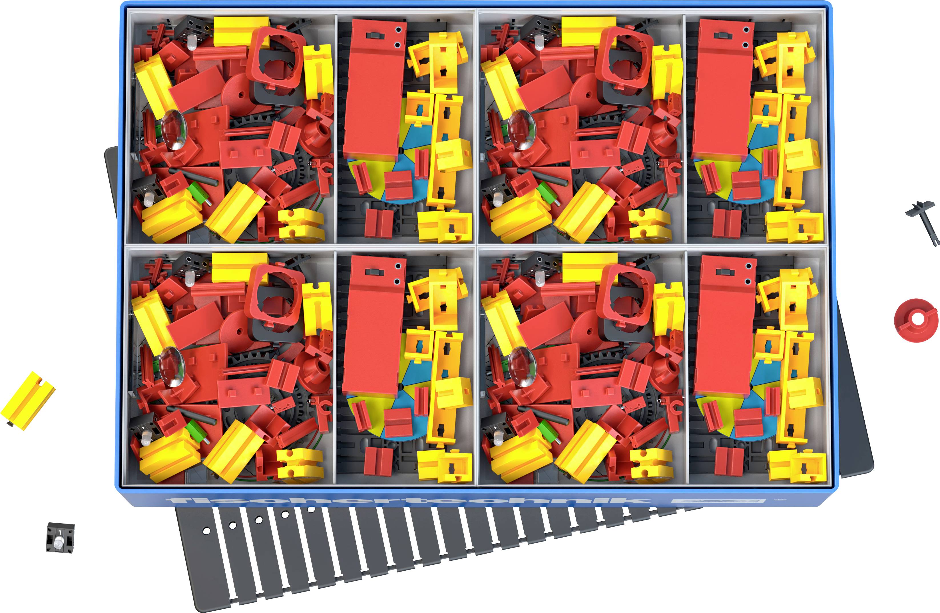 Ein Bild zeigt einen offenen Kasten mit sechs Fächern voller bunter LEGO-Teile in Rot und Gelb. Einige Teile sind außerhalb des Kastens verstreut.