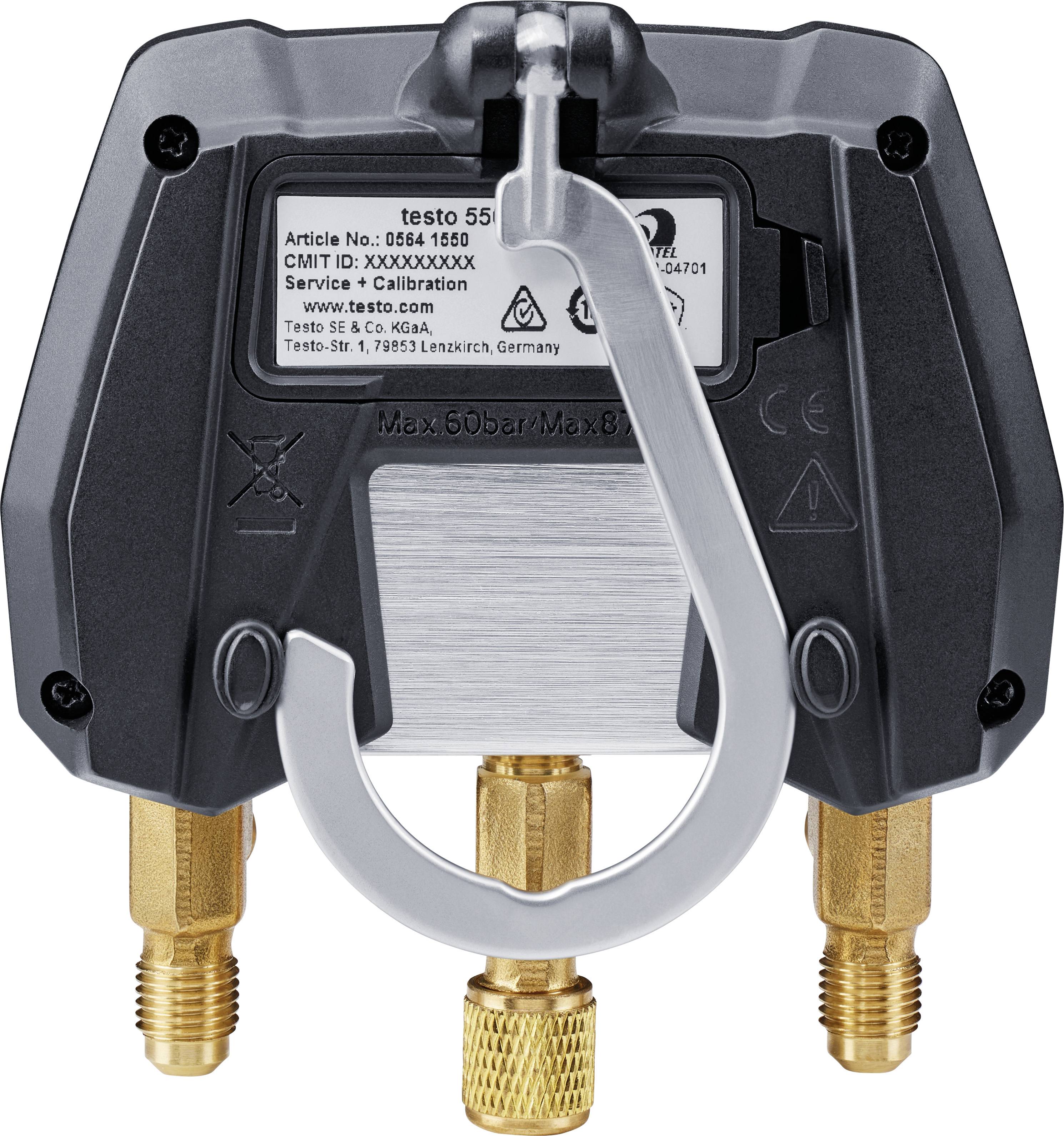 Das Bild zeigt ein technisches Gerät mit drei Messinganschlüssen und einem Haken zur Befestigung. Oben ist ein Etikett mit technischen Informationen.