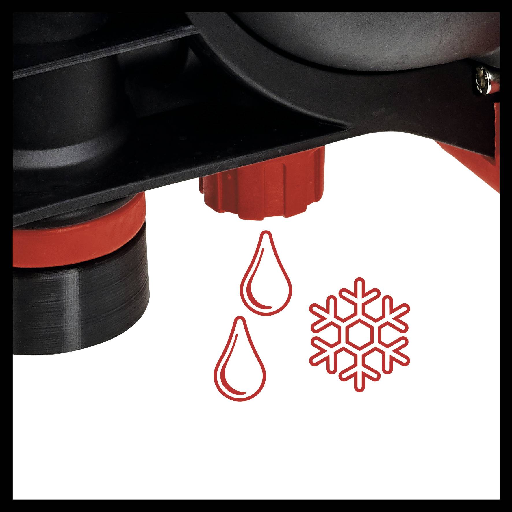 Nahaufnahme eines Heizungsventils mit roten Drehknöpfen und Piktogrammen für Wassertröpfchen und Schneeflocke, die Temperaturkontrolle darstellen.