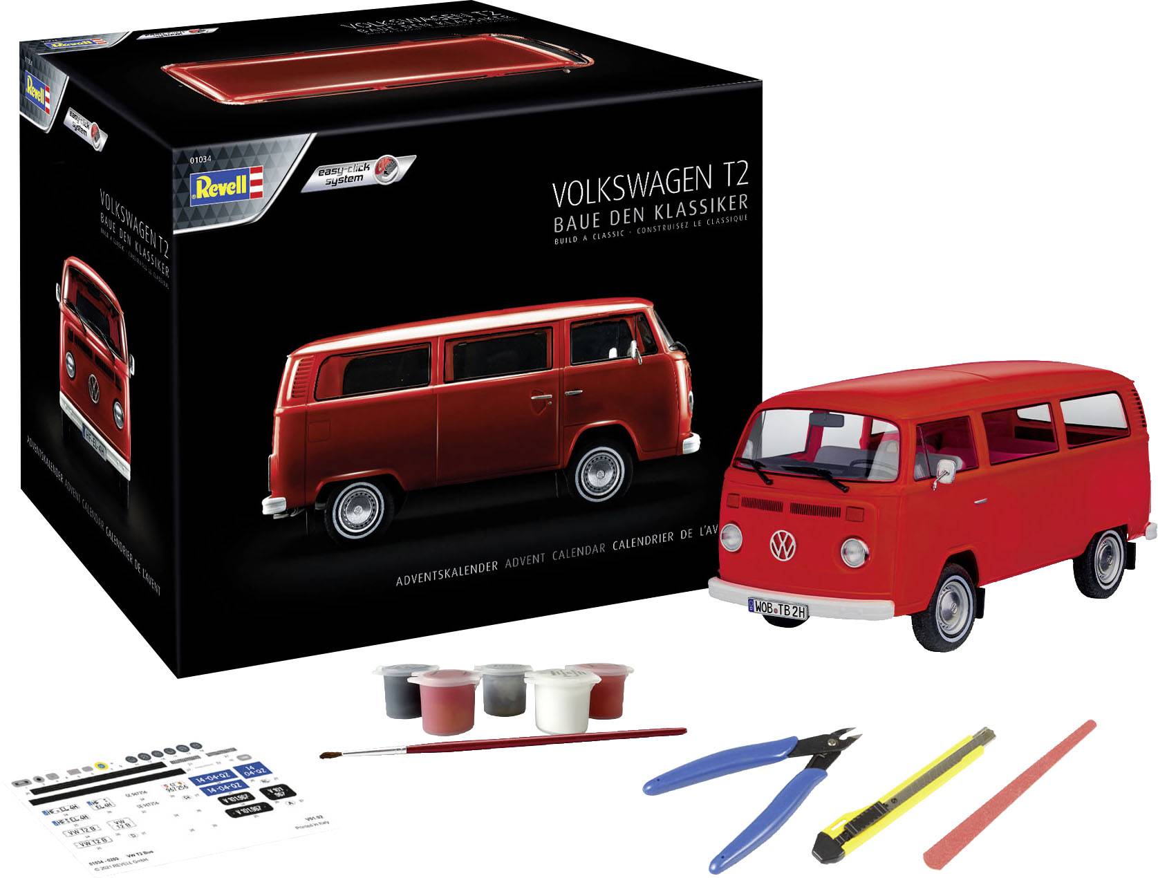Ein rotes Volkswagen T2 Modellauto, ein Bausatz von Revell. Auf der Verpackung steht 'Volkswagen T2. Baue den Klassiker'. Zubehörteile sind Pinsel, Farben und Werkzeuge.