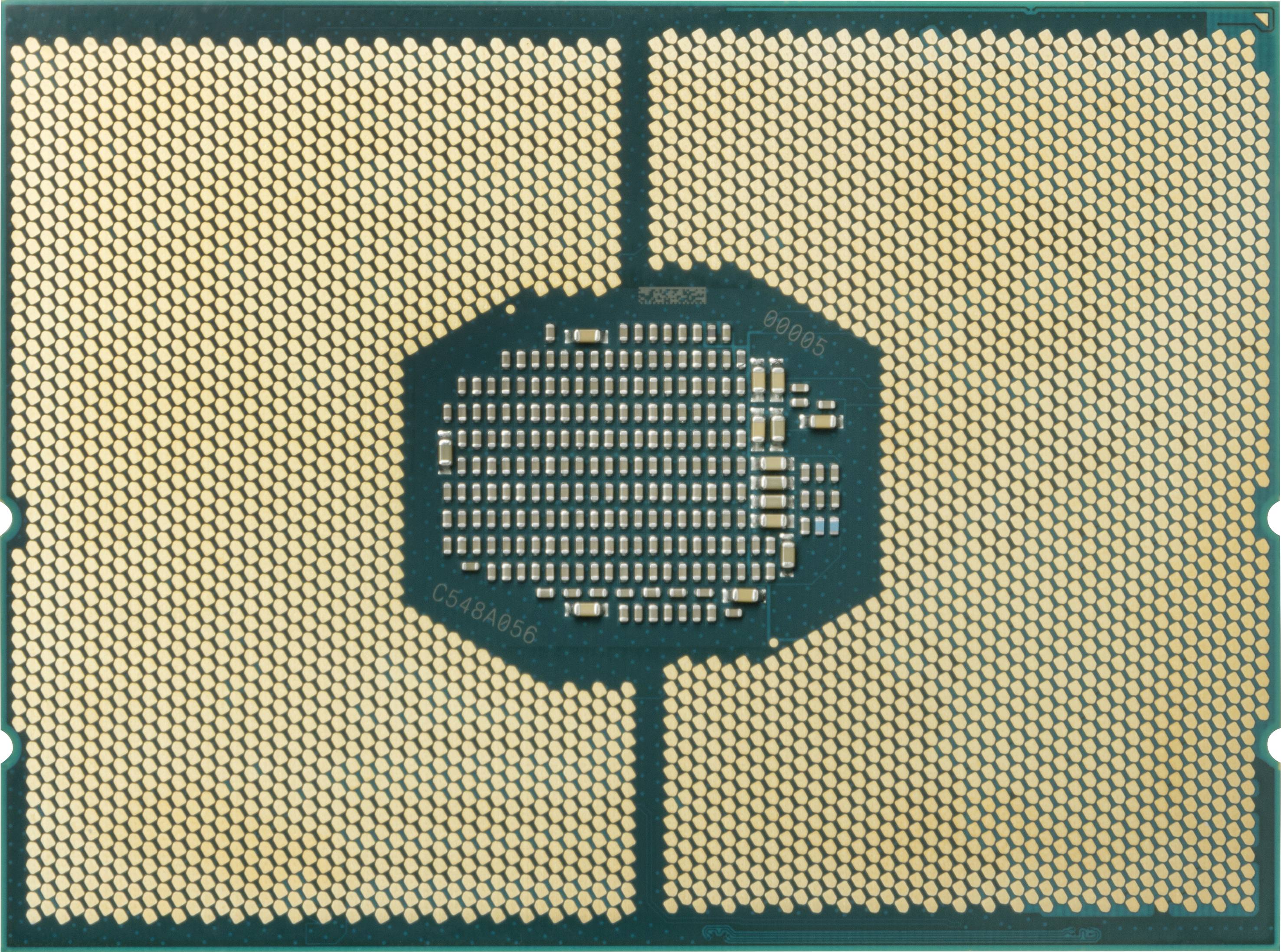Ein Mikrochip mit zahlreichen goldenen Kontaktpunkten auf einer grünen Platine.