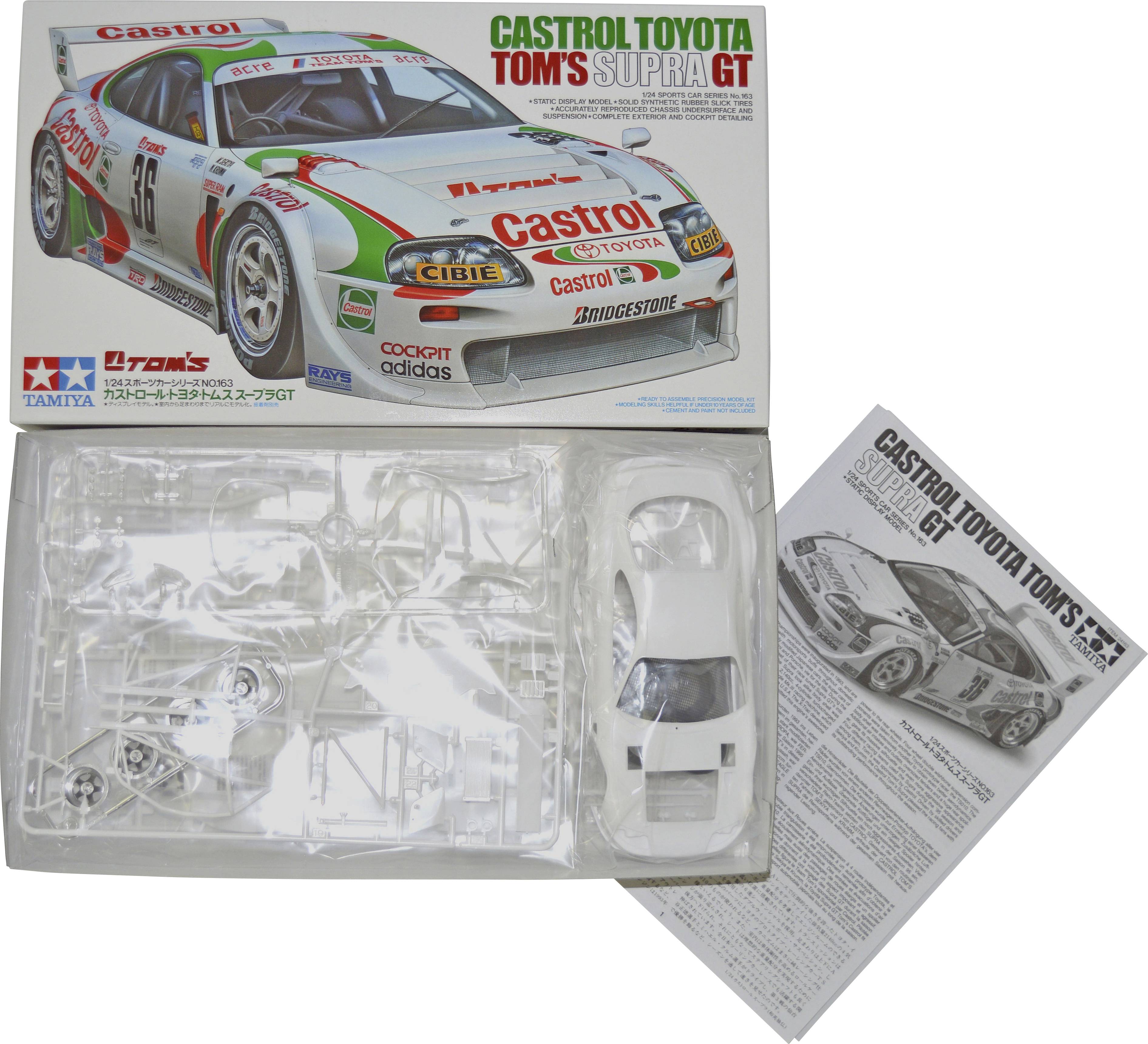 Bausatz eines Castrol Toyota Supra GT Modellautos von Tamiya. Zeigt das verpackte Auto, Teile und Anweisungen.