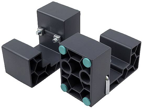 'Zwei schwarze Kunststoffhalterungen mit Metallklemmen, hexagonalen Mustern und grünen Gummifüßen, abgewinkelt dargestellt.'