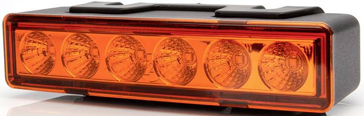 Ein rechteckiges, orangefarbenes Rücklicht mit sechs Reflektoren, häufig an Fahrzeugen zur Signalisierung verwendet.