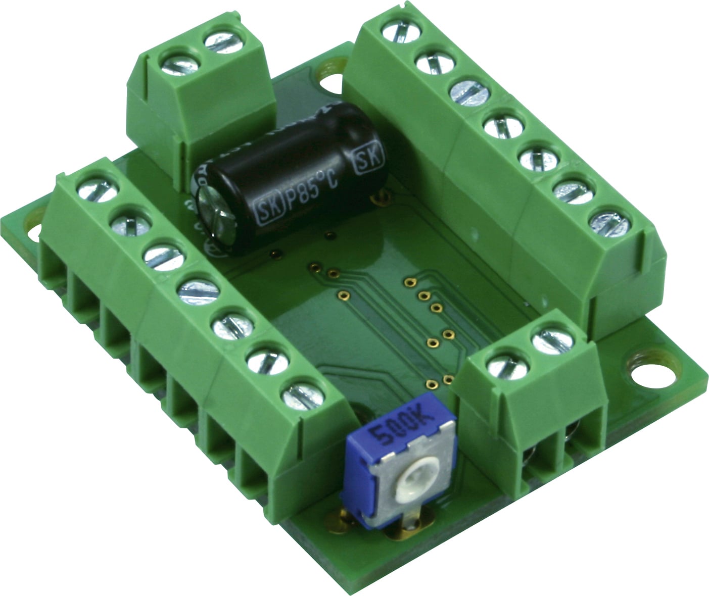 Grüne elektronische Platine mit mehreren Schraubklemmen und einem schwarzen Kondensator, geeignet für elektrische Verbindungen.