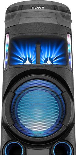 Großer Lautsprecher mit zwei beleuchteten Bereichen oben und einem großen Lautsprecher unten, eingebaute Lichter leuchten blau.