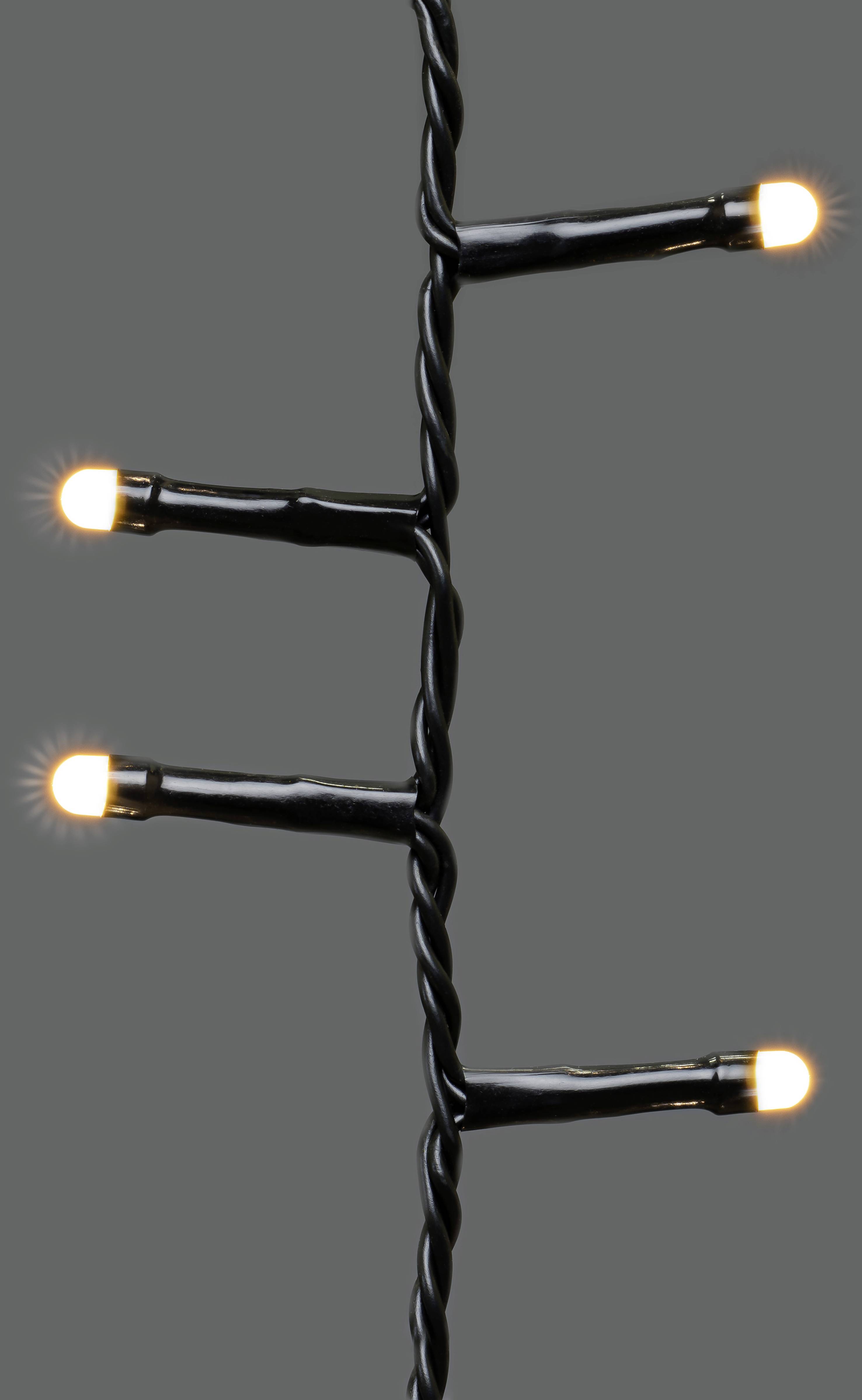 Strang mit vier kleinen, leuchtenden Lichtern auf grauem Hintergrund.