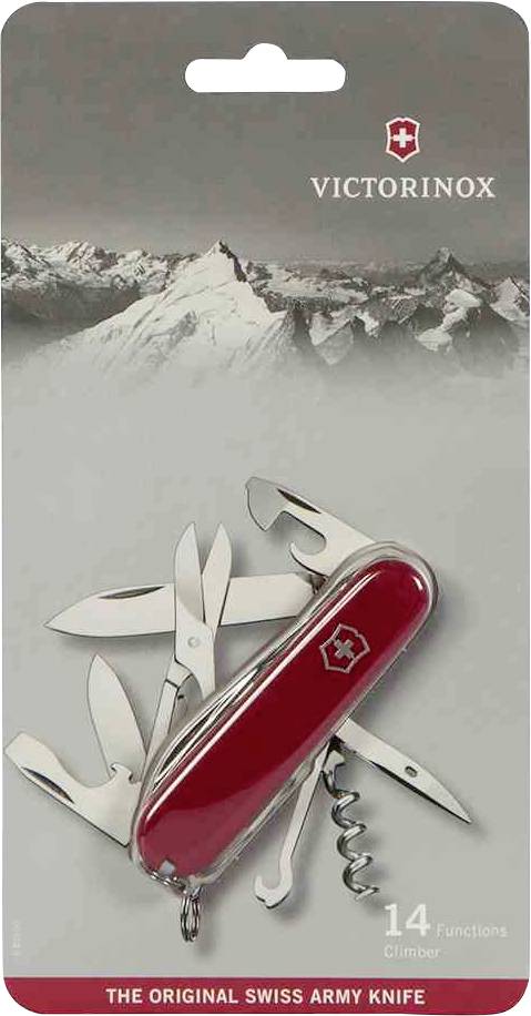 Rotes Schweizer Taschenmesser mit 14 Funktionen, darunter Messer, Schere, und Dosenöffner, vor Bergkulisse. Verpackung zeigt Marke 'Victorinox'.