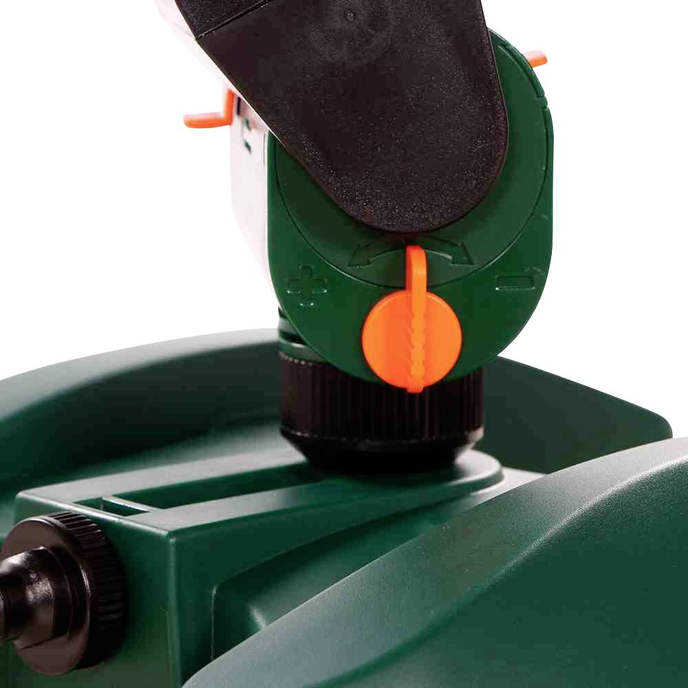 Grünes Gerät mit einem orangenen Drehknopf und schwarzem Hebel, möglicherweise eine Einstellung oder Steuerung.