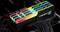RAM-Riegel von G.Skill mit bunter RGB-Beleuchtung, montiert auf einem Motherboard.