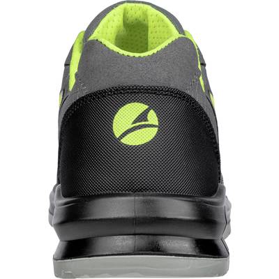 Ein grauer Sportschuh von hinten mit schwarzer Ferse und leuchtend grünen Akzenten.