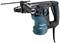 Ein elektrischer Bohrhammer von Makita mit einem Kunststoffgehäuse in Blau und Schwarz, geeignet für schwere Bohrarbeiten.