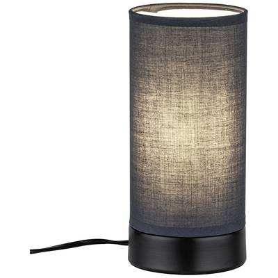 Zylindrische Tischlampe mit schwarzem Sockel und schwarzem Stoffschirm, die leuchtet.