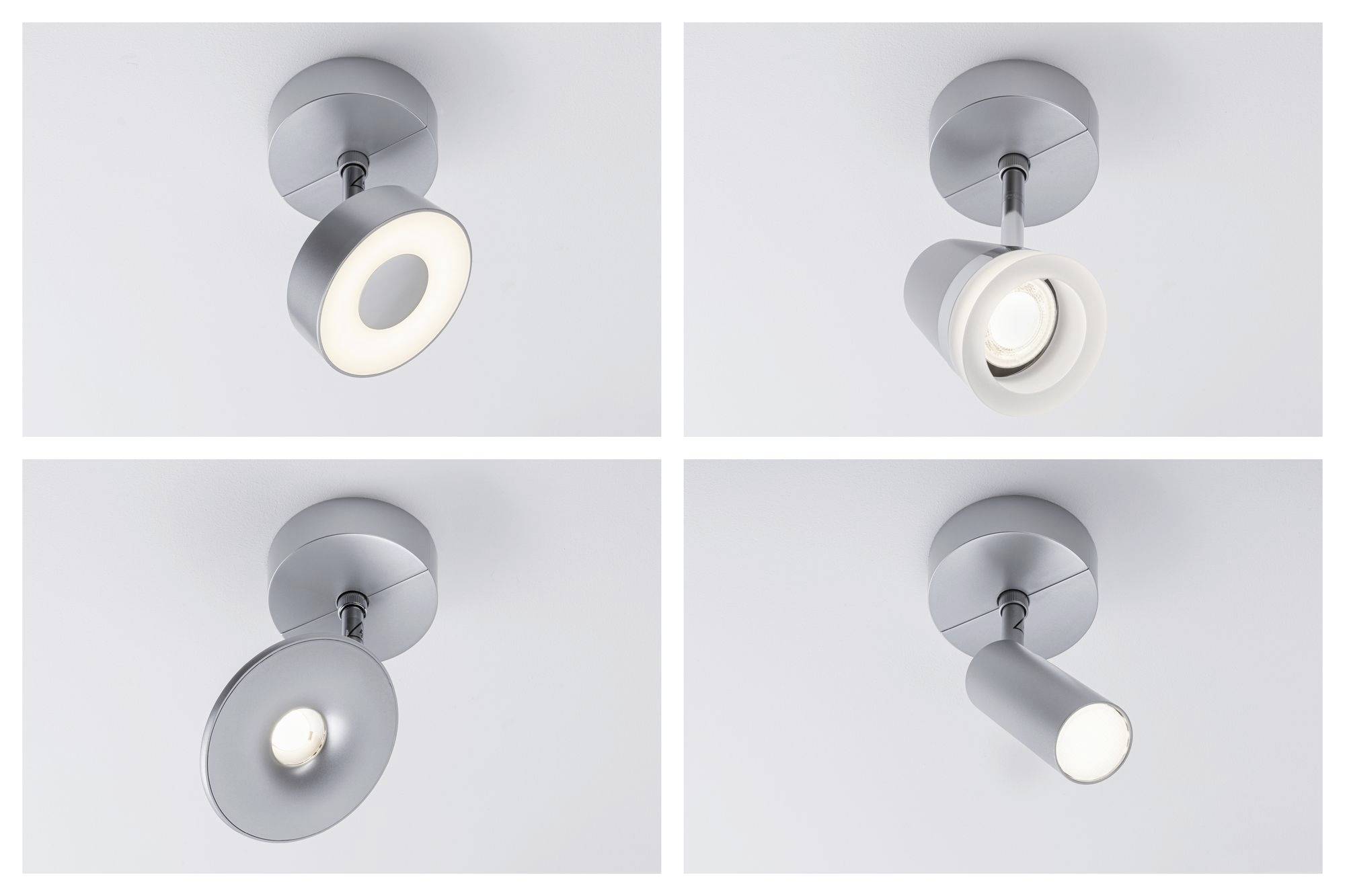 Vier moderne, silberne Deckenstrahler in verschiedenen Designs, jeweils mit rundem Sockel und zylindrischem Gehäuse, auf weißem Hintergrund.