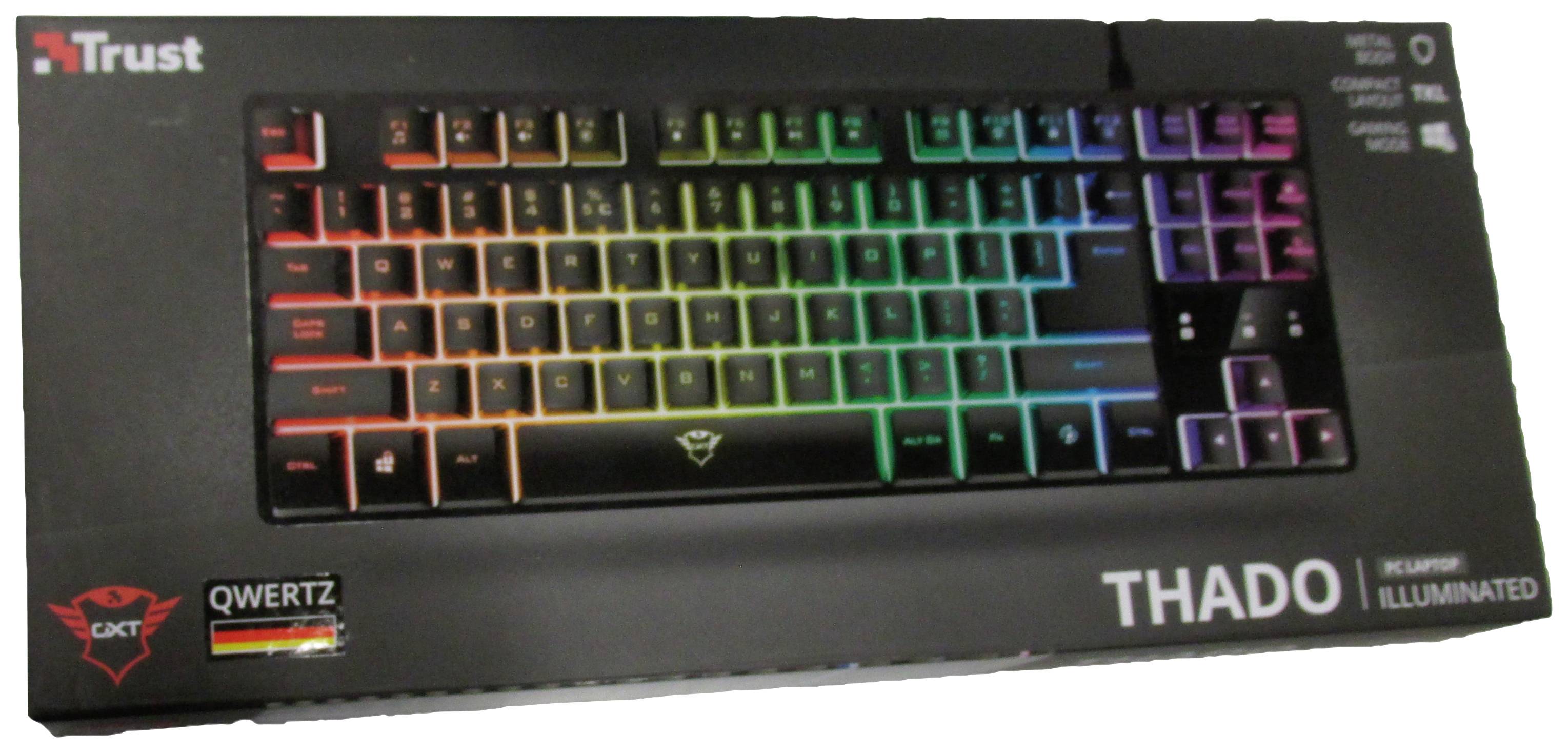 Eine qwertz-beleuchtete Trust-Thado-Tastaturverpackung mit mehrfarbiger Hintergrundbeleuchtung, geeignet für Gaming.