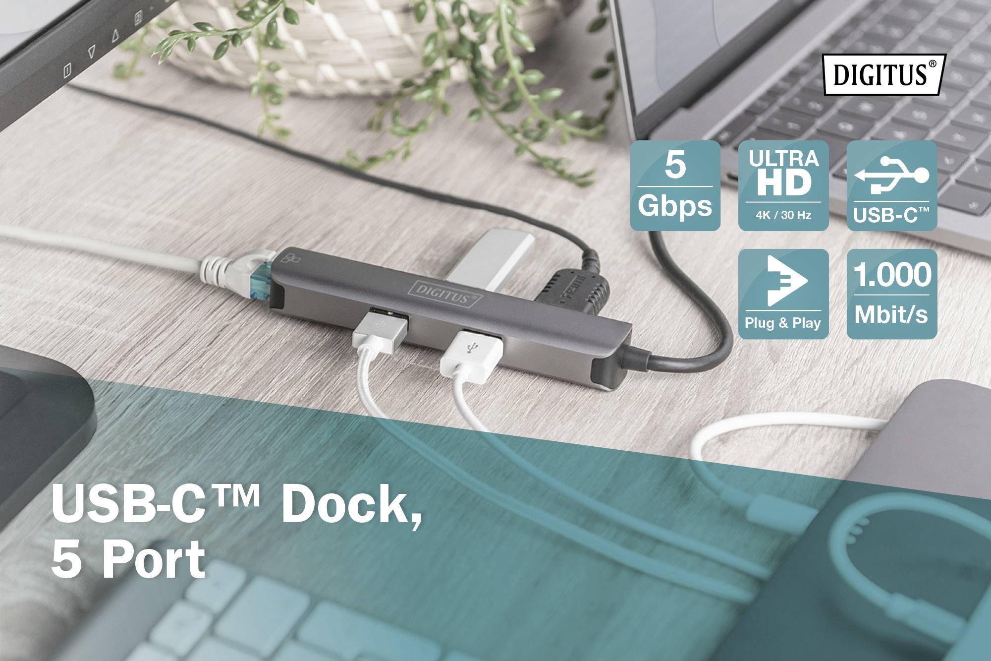 USB-C™ Dockingstation mit 5 Ports auf Schreibtisch. Anschluss von mehreren Geräten. Datenübertragungsrate: 5 Gbps, 1000 Mbit/s.